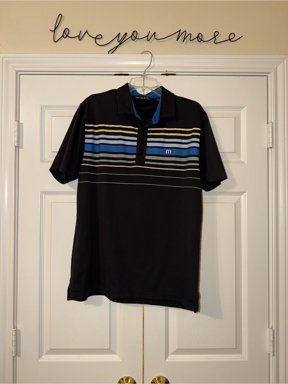 Travis Mathew Black Polo with Blue, Yellow and White Stripes
